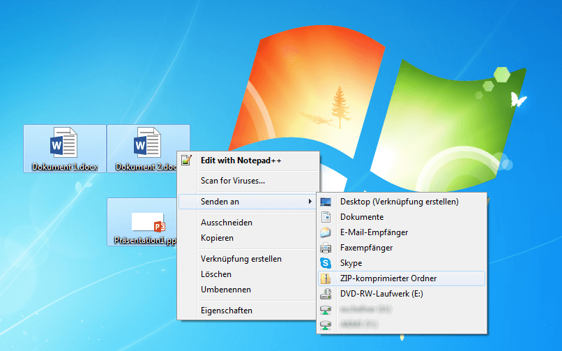 Screenshot vom Windows-Desktop, auf dem mehrere Dateien über das Kontextmenü an einen ZIP-komprimierten Ordner gesendet werden