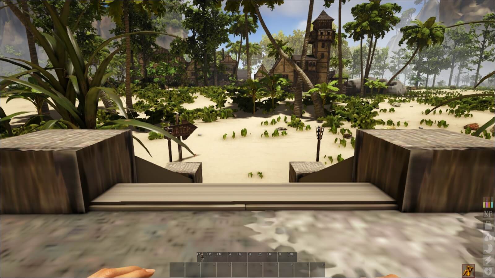 Screenshot aus ATLAS: Zu sehen ist eine tropische Landschaft mit einigen Fachwerk-Gebäuden.